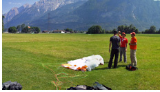 Lienz landing :: Lienz paragliding landing field. Discussing a fresh XC flight from Greinfenburg, Tyrol, High Tauern Alps, Austria