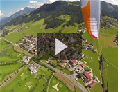 Paragliding from Schmittenhohe launch above The Hohe Tauern Alps in Salzach valley, Pinzgau, Austria