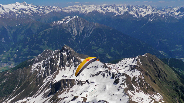 Paragliding above Matrei toward Glosglockner, Tyrol, Austria