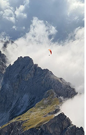 Paragliding Dolomites. Catinaccio Massif, Val di Fassa, Italy