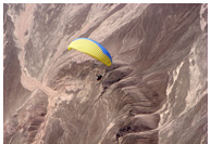 Littoral of Chipana - Paragliding above desert plains of Litoral of Chipana, Iquique, Atacama Desert, Chile - Pilot: Chuck Savall, USA - Fly Atacama 2008 participant